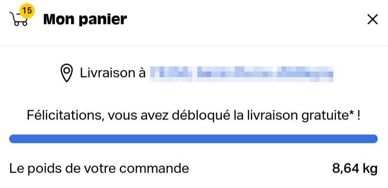 Capture d'écran du panier montrant 15 articles et un poids total de 8,64 kg, avec le message « Félicitations, vous avez débloqué la livraison gratuite ! ».